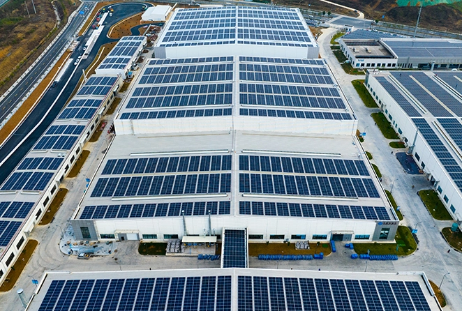 Top-down view of a large solar panel factory in Jaipur, Rajasthan, representing advancements in solar energy technology.