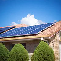 Solar panels on a residential roof in Jaipur, Rajasthan, promoting the use of solar energy for a greener future