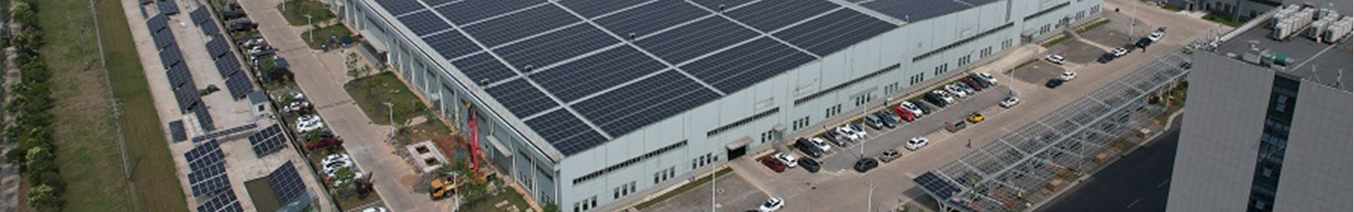 Aerial shot of a prominent building in Jaipur, Rajasthan, showcasing solar panels that utilize solar energy.
